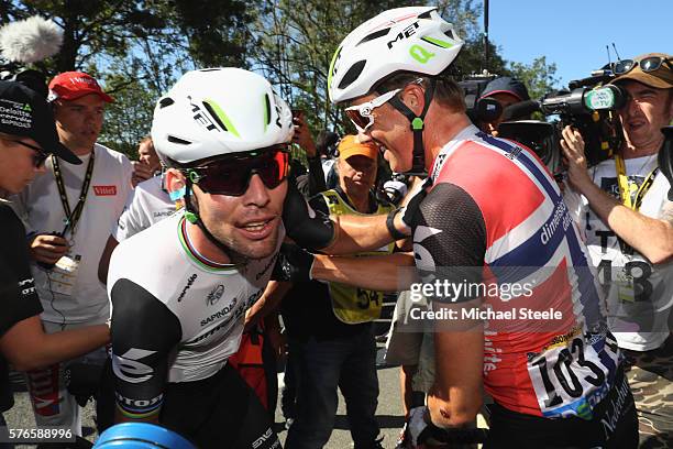 Mark Cavendish of Great Britain and Team Dimension Data is congratulated by team mate Edvald Boasson Hagen of Norway after clinching the stage...