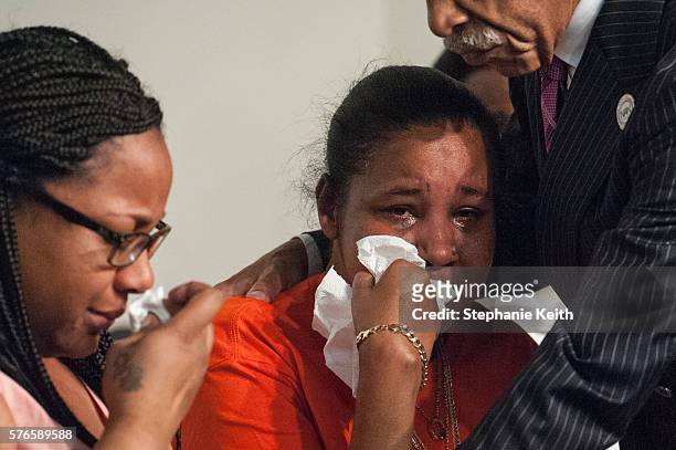 Eric Garner's widow, Esaw Garner , and Emerald Garner , one of his children, cry during an event held by Al Sharpton at the National Action Network...