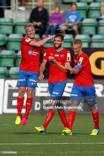 Mikael Dahlberg, Andreas Landgren and Peter Larsson of Helsingborgs IF celebrates after scoring during the match between GIF Sundsvall and...