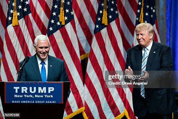 Republican presidential candidate Donald Trump introduces his newly selected vice presidential running mate Mike Pence , governor of Indiana, during...