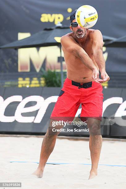 Todd Rogers sets the ball during his round of 16 match against Casey Patterson and Jake Gibb at AVP Beach Volleyball Manhattan Beach on July 16, 2016...