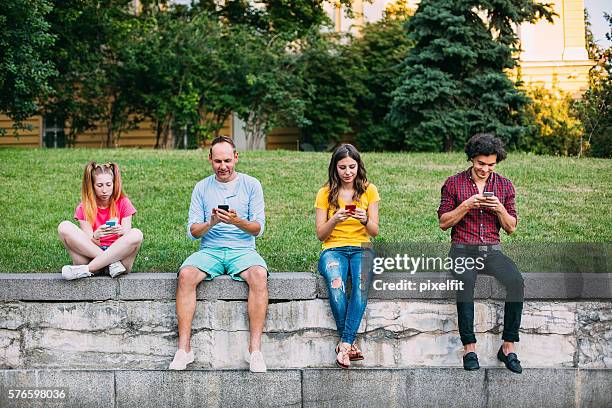 Texted Crowd Of People Talking Texting Photos and Premium High Res Pictures ...