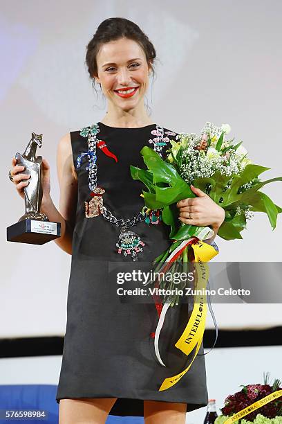 Actress Gabriella Pession poses with the Giffoni award on July 16, 2016 in Giffoni Valle Piana, Italy.