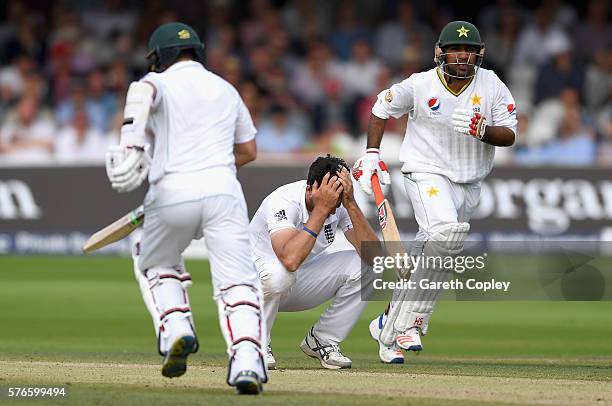 Steven Finn of England reacts as Yasir Shah and Sarfraz Ahmed of Pakistan score runs during day three of the 1st Investec Test between England and...