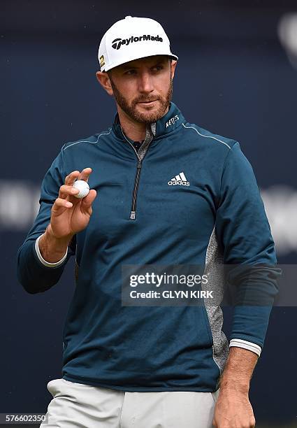 Golfer Dustin Johnson reacts on the 18th green after his third round 72 on day three of the 2016 British Open Golf Championship at Royal Troon in...