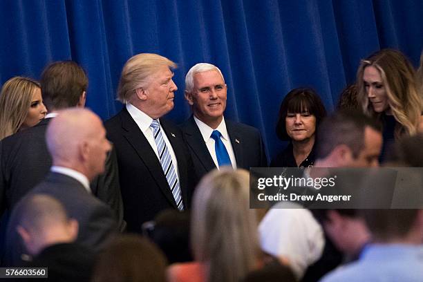Republican presidential candidate Donald Trump stands with his newly selected vice presidential running mate Mike Pence, governor of Indiana, at the...