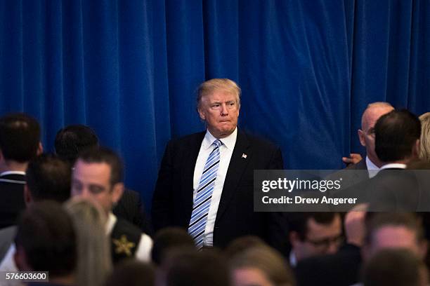 Republican presidential candidate Donald Trump pauses at the end of an event with his newly selected vice presidential running mate Mike Pence,...