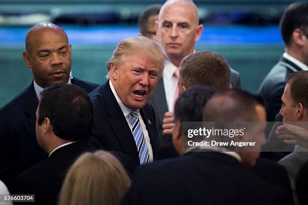 Republican presidential candidate Donald Trump speaks to members of the audience at the end of an event with his newly selected vice presidential...