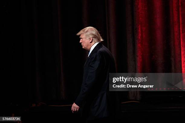 Republican presidential candidate Donald Trump leaves the stage at the end of an event with his newly selected vice presidential running mate Mike...
