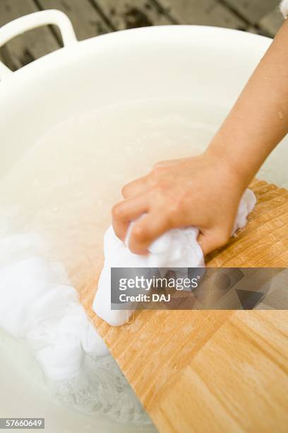kids hand, washing a laundry - washboard laundry stock pictures, royalty-free photos & images