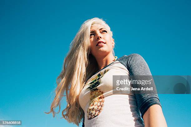 low angle view woman - bleached hair stock-fotos und bilder