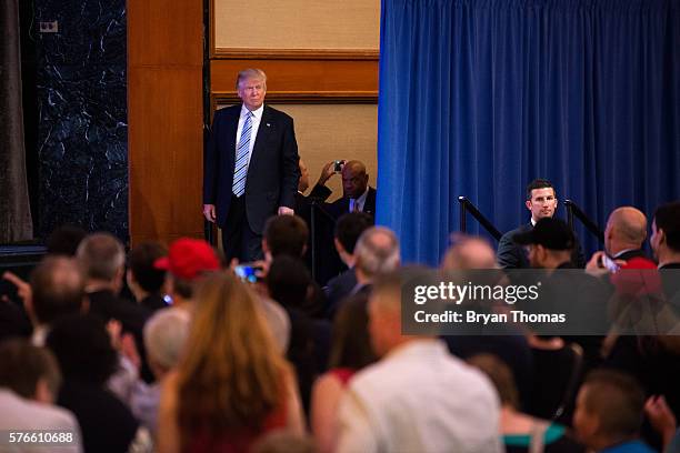 Republican presidential candidate Donald Trump steps onto the stage before introducing his vice presidential running mate Indiana Gov. Mike Pence at...