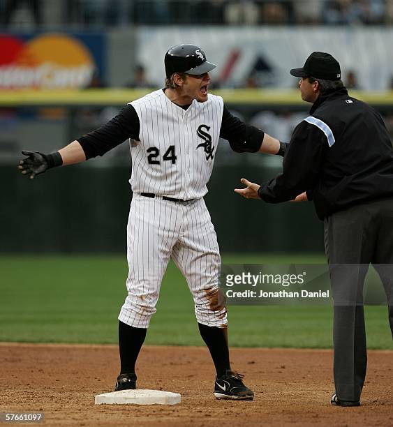 Joe Crede of the Chicago White Sox argues with second base umpire Paul Nauert after being called out in the fourth inning against the Chicago Cubs...
