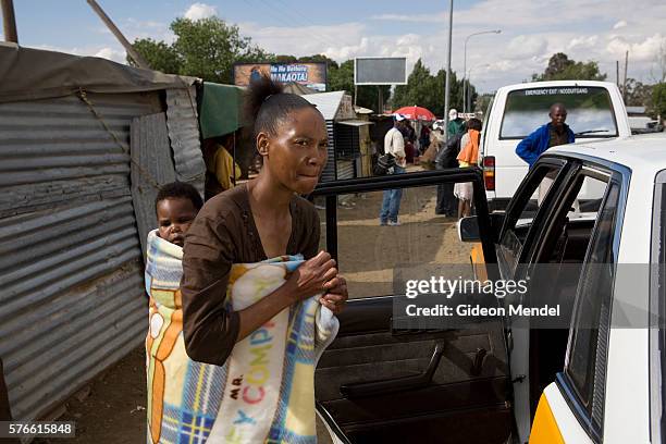 Ntsiuoa Ralefifi travels from her home to the hospital in Mafeteng carrying her daughter, Nthatisi Nkaota, on her back. The distance from her home in...