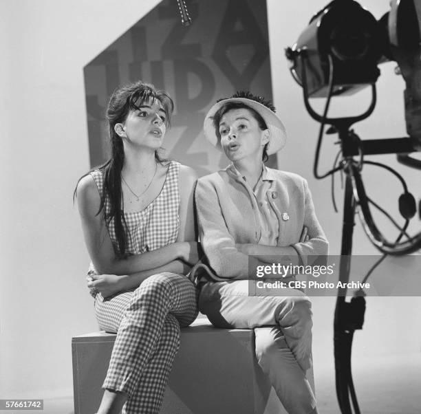 American singer and actress Judy Garland rehearses with her daughter Liza Minnelli on the set of her musical variety series, 'The Judy Garland Show,'...