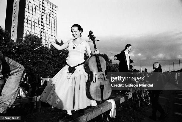 woman with cello during reclaim the streets protest - protest archival stock pictures, royalty-free photos & images