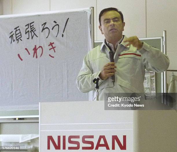 Japan -Nissan Motor Co. President Carlos Ghosn speaks to employees at the automaker's Iwaki plant, which was damaged by the March 11 earthquake, in...