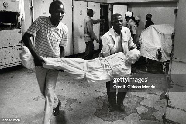 men carrying corpse in mortuary - dead body morgue stock pictures, royalty-free photos & images