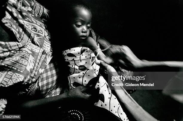 nurse inserting drip in patient's arm - inserting iv stock pictures, royalty-free photos & images