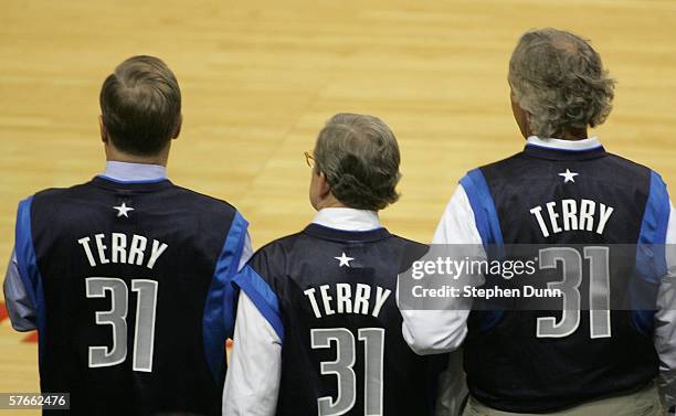 Fans of the Dallas Mavericks are seen wearing jerseys in support of Jason Terry, who was suspended from the game for punching Michael Finley of the...