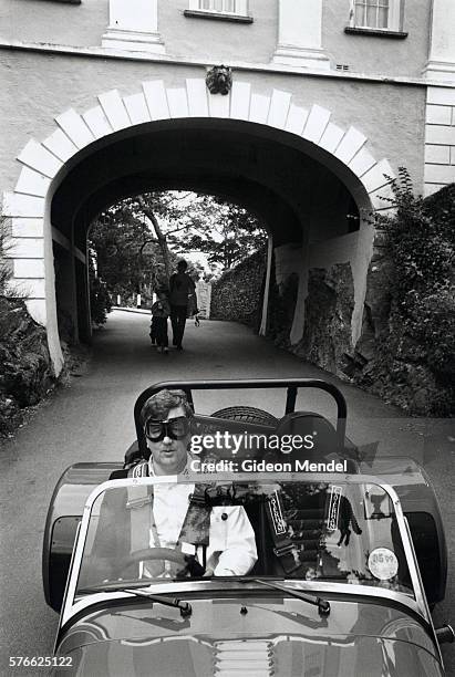 racecar driver reenacting scene from the prisoner television show - portmeirion stock pictures, royalty-free photos & images