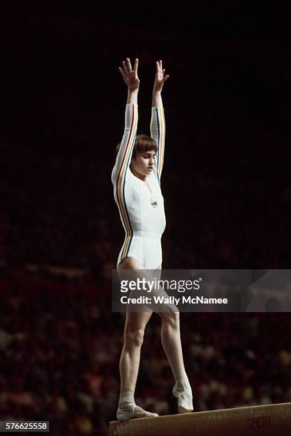 Nadia Comaneci performs in the balance beam competition at the 1976 Olympics in Montreal. She was the first Olympic gymnast to score a perfect 10.