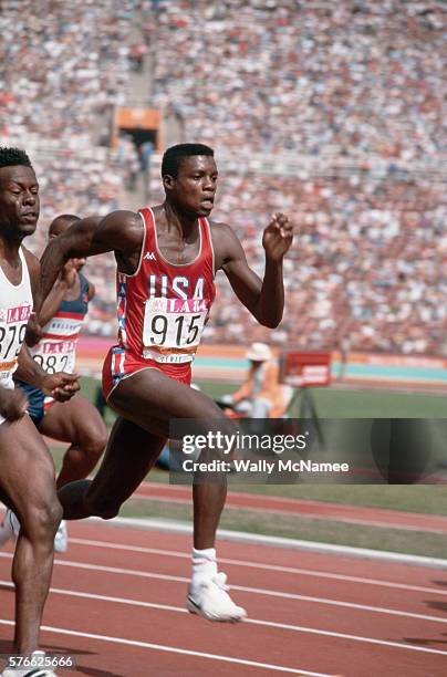 American sprinter Carl Lewis competes in a sprint competition at the 1984 Summer Olympics in Los Angeles. Lewis would go on to win four gold medal in...