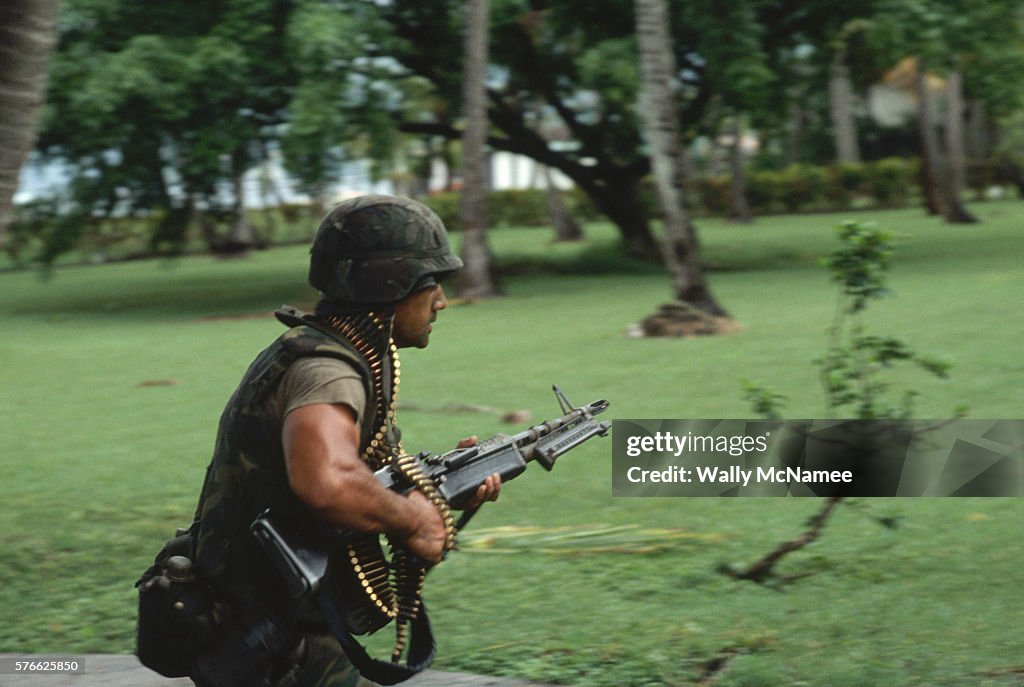 Machine Gun Walk An American soldier from the 82nd Airborne Division rushes with his ...