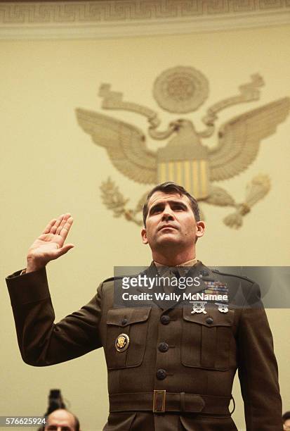United States Marine Corp Lieutenant Colonel Oliver North is sworn in to testify before a House committee holding hearings on the Iran-Contra affair.