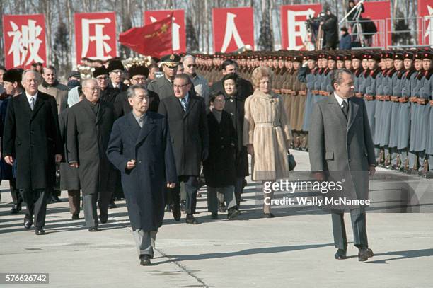 President Richard Nixon begins his 1972 trip to China by reviewing the People's Liberation Army honor guard at the Beijing Airport, escorted by...