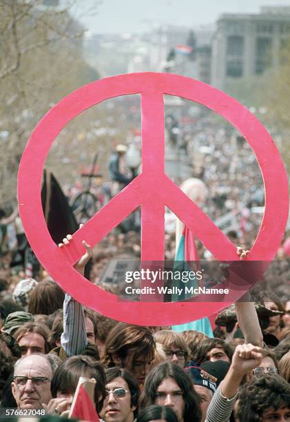 Protesters Holding a Large Peace Sign