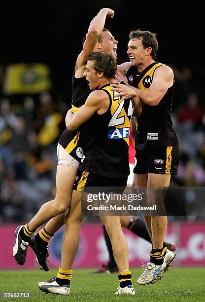 Brett Deledio, Chris Newman and Mark Coughlan of the Tigers celebrate a goal during the round eight AFL match between the Richmond Tigers and the...
