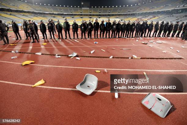Egyptian security forces stand guard following the CAF Champions League group A stage football match between Egypt's Al-Ahly and Morocco's Wydad...