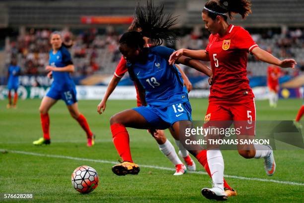 France's forward Kadidiatou Diani vies for the ball with China's Defender Wu Haiyan during the women's friendly football match between France and...