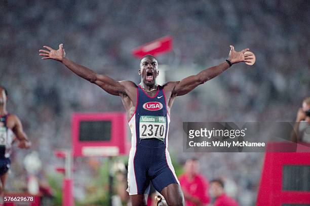 Sprinter Michael Johnson wins the 200-meter run setting a world record of 19.32 seconds at the 1996 Atlanta Olympic Games.