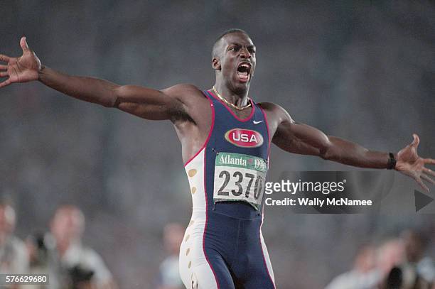 Sprinter Michael Johnson wins the 200-meter run setting a world record of 19.32 seconds at the 1996 Atlanta Olympic Games.