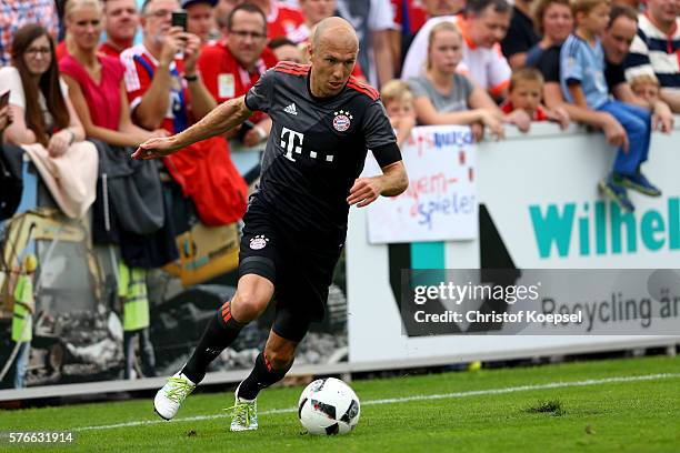 Arjen Robben of Bayern Muenchen runs with the ball during the friendly match between SV Lippstadt and FC Bayern at Stadion am Bruchbaum on July 16,...