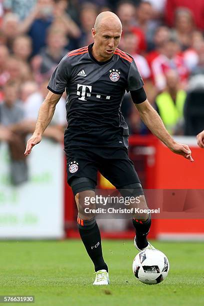 Arjen Robben of Bayern Muenchen runs with the ball during the friendly match between SV Lippstadt and FC Bayern at Stadion am Bruchbaum on July 16,...