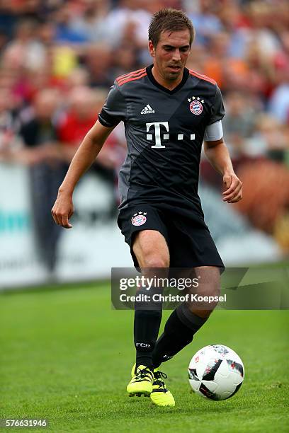 Philipp Lahm of Bayern Muenchen runs with the ball during the friendly match between SV Lippstadt and FC Bayern at Stadion am Bruchbaum on July 16,...