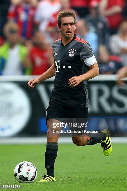 Philipp Lahm of Bayern Muenchen runs with the ball during the friendly match between SV Lippstadt and FC Bayern at Stadion am Bruchbaum on July 16,...