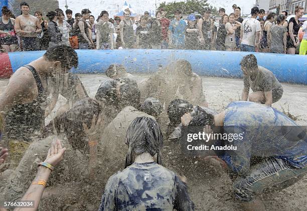 July 16: People enjoy the moment during the Boryeong Mud Festival in Daecheon Beach on July 16, 2016 in Seoul, South Korea.