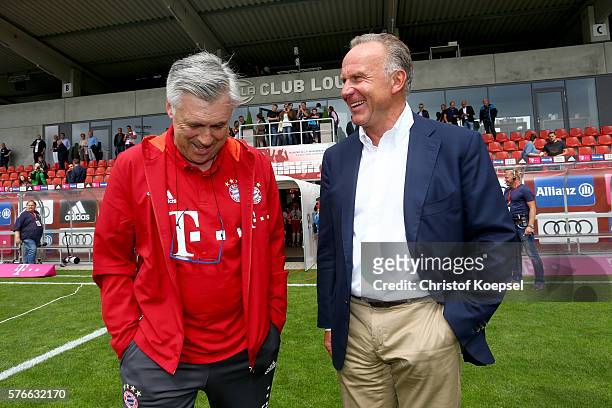 Head coach Carlo Ancelotti of Bayern and Karl-Heinz Rummenigge of Bayern talk prior to the friendly match between SV Lippstadt and FC Bayern at...