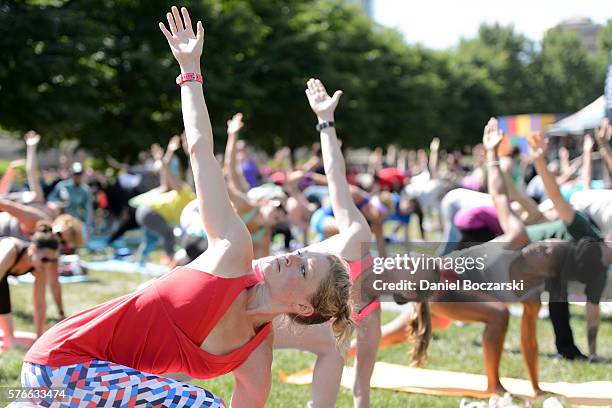 Fitbit Local Ambassadors Jeremy Walton and Jenny Finkel lead participants in a bootcamp and yoga workout during the launch of Fitbit Local Free...