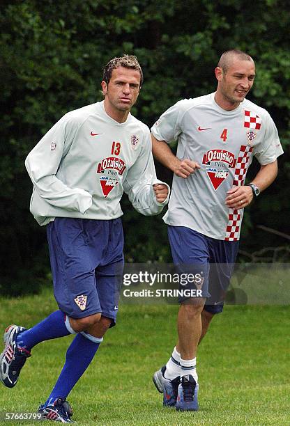 Croatian national football team players Stjepan Tomas and Robert Kovac warm up during the team's first training session in Brezice, 20 May 2006,...