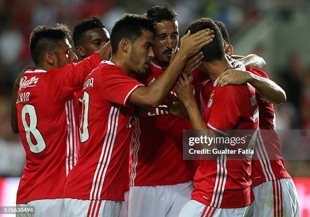 Benfica's forward Rui Fonte celebrates with teammates after scoring a goal during the Algarve Football Cup Pre Season Friendly match between SL...