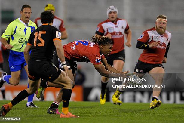 Lions' centre Howard Mnisi catches the ball past Jaguares' full back Joaquin Tuculet during their Super Rugby match at Jose Amalfitani stadium in...