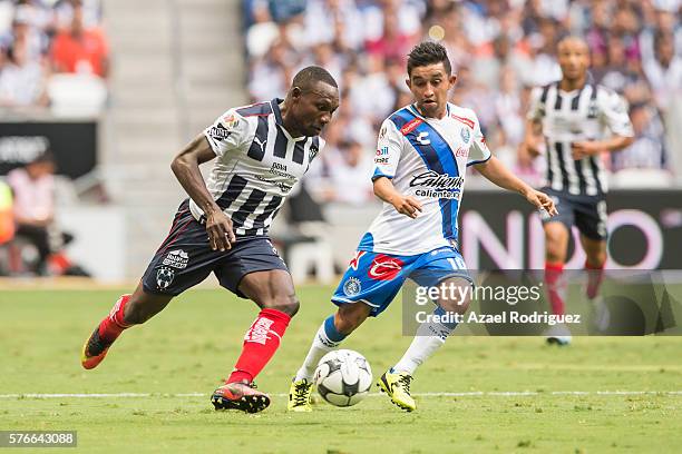 Walter Ayovi of Monterrey fights for the ball with Christian Bermudez of Puebla during the 1st round match between Monterrey and Puebla as part of...