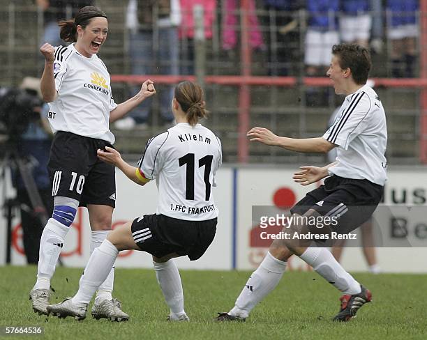 Frankfurts Renate Lingor celebrates whr first goal with Katrin Kliehm and Tina Wunderlich during the Women's UEFA Cup Final first leg match between...