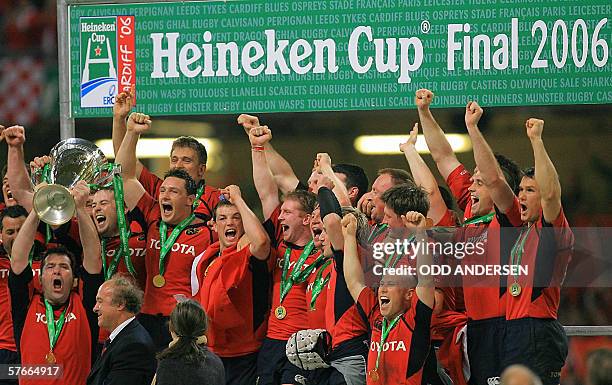 Cardiff, UNITED KINGDOM: Irish team Munster celebrates with the Heineken Cup European final trophy at the Millennium Stadium in Cardiff, 20 May 2006...