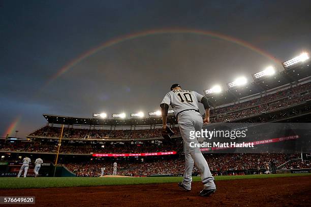 Jordy Mercer of the Pittsburgh Pirates walks onto the field under a rainbow in the first inning against the Washington Nationals at Nationals Park on...